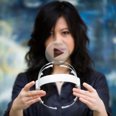 Tan Le with her design for a headset that can read its user's branwaves to control virtual and physical electronics.